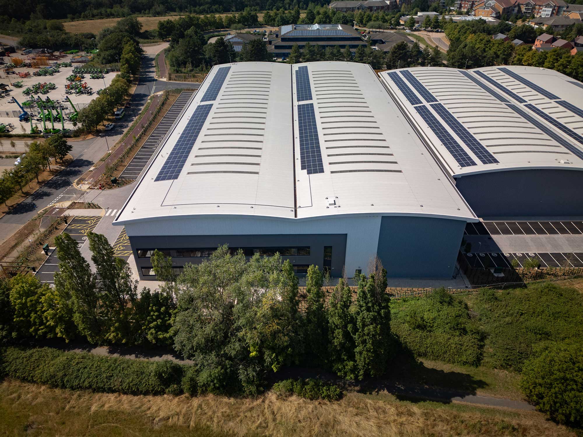 Aerial view of the completed unit showing rooftop solar panels