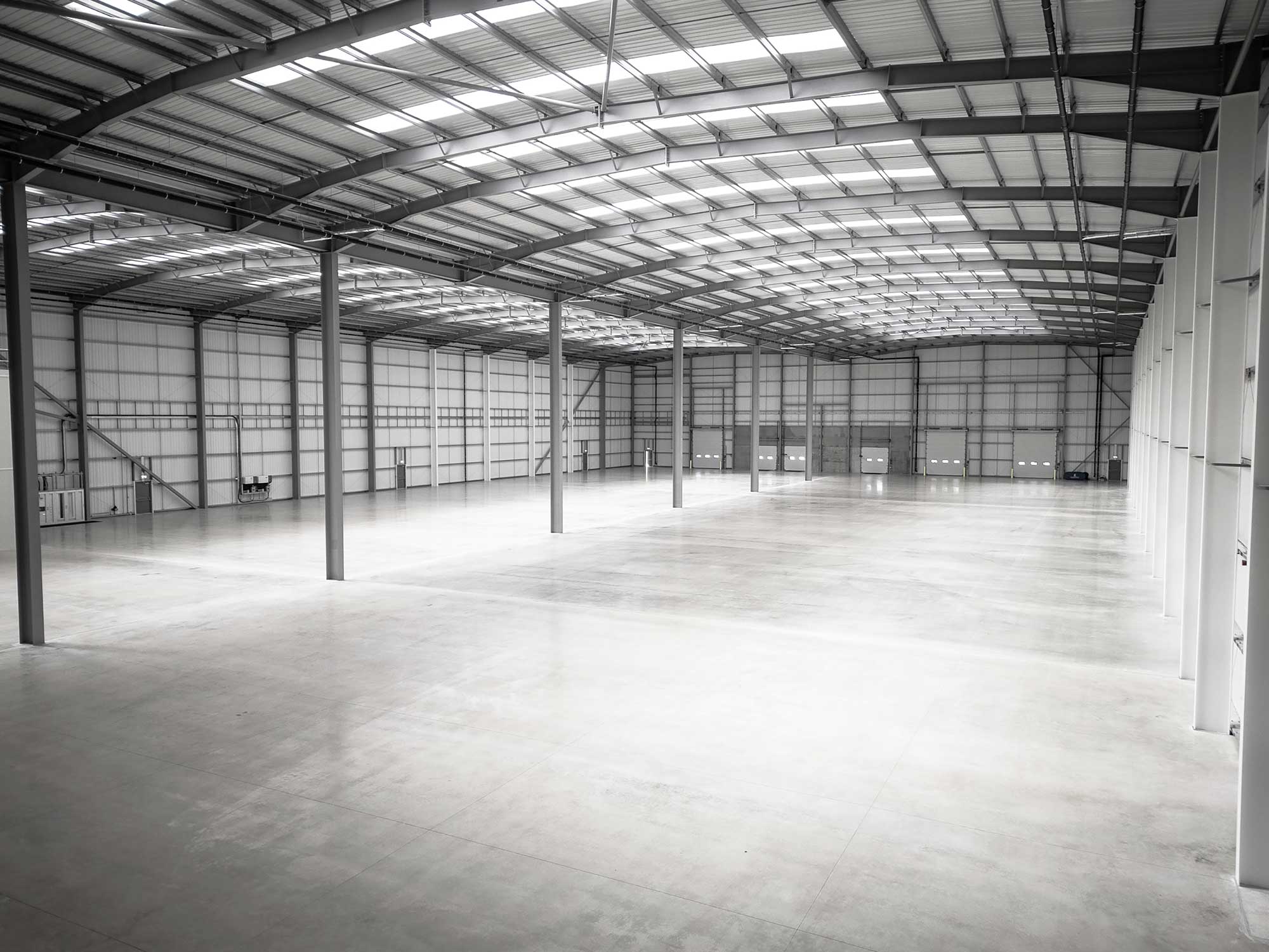 Warehouse interior showing clear span steel frame and power floated floor